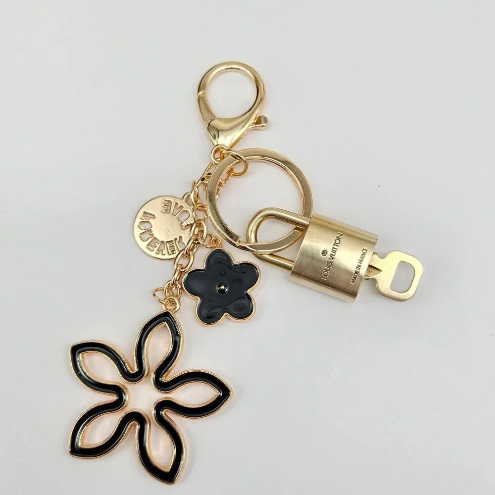 Louis Vuitton Gold-Tone Crystal Flower Keychain with Black Accent